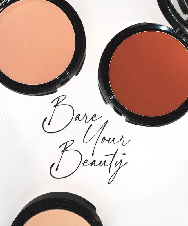 bareMinerals powder compacts arranged around the handwritten line Bare Your Beauty
