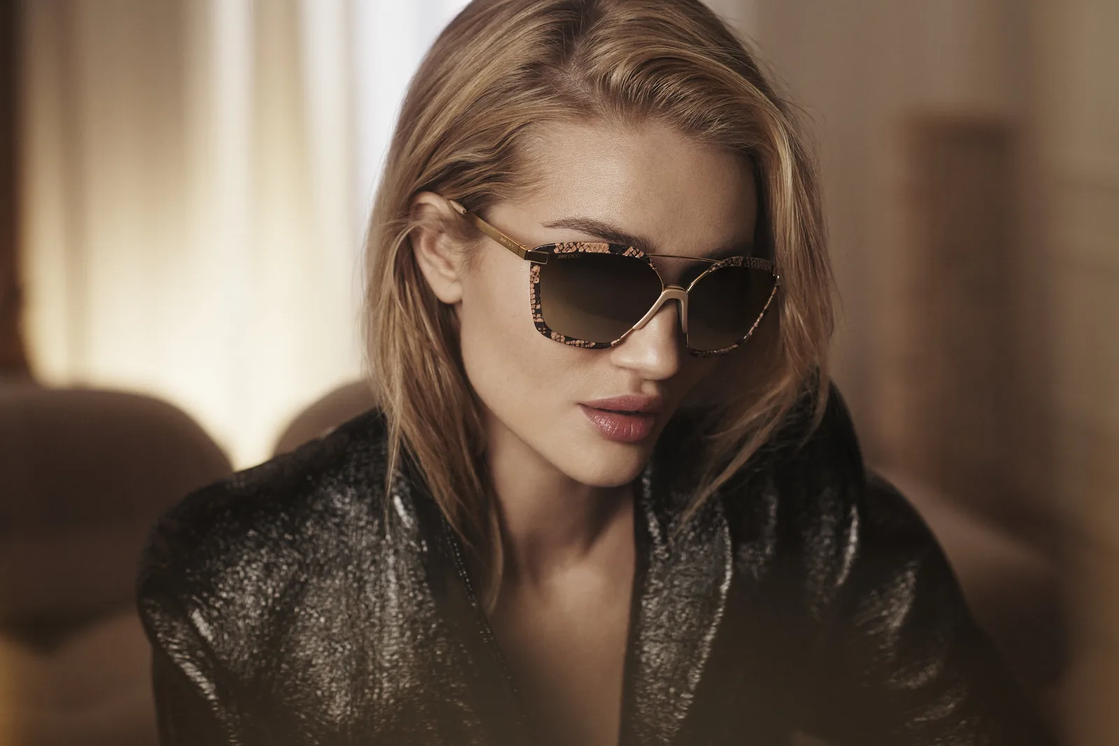 Jimmy Choo FW18 campaign still: Rosie Huntington-Whiteley in tortoiseshell sunglasses and a black jacket
