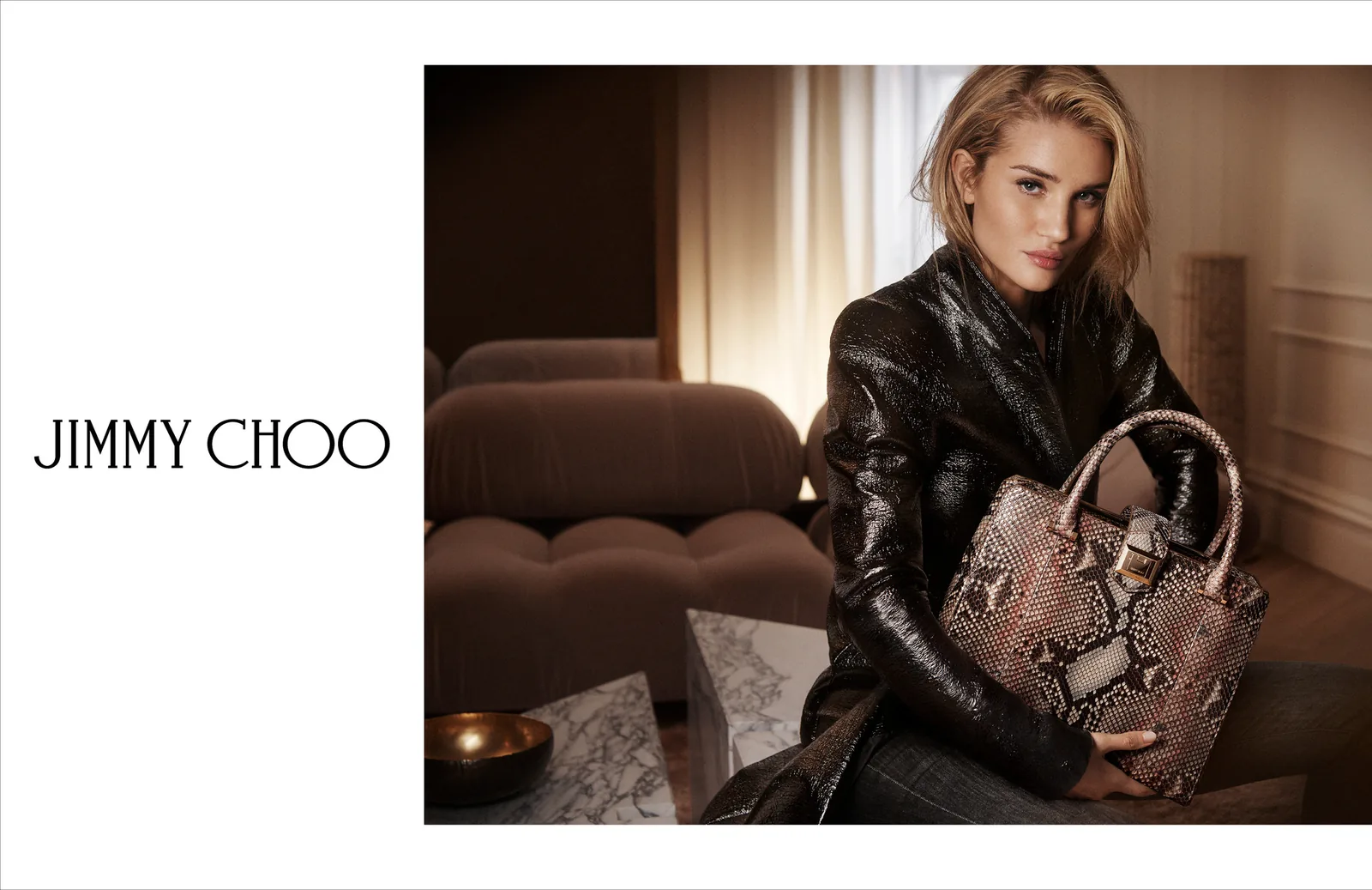Jimmy Choo FW18 print ad layout: Rosie Huntington-Whiteley with a python-print bag, with the wordmark
