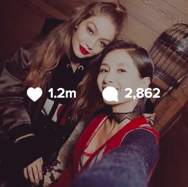 Instagram selfie of Gigi Hadid in red lipstick with a fan, 1.2 million likes
