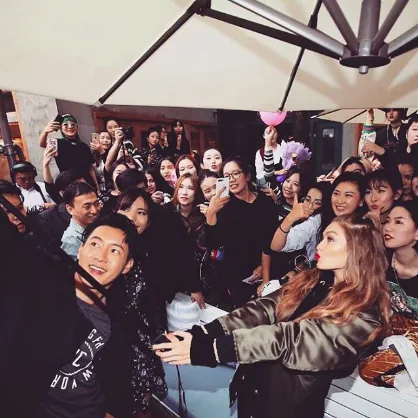Gigi Hadid greets a crowd of fans at a rooftop tour event, Shanghai