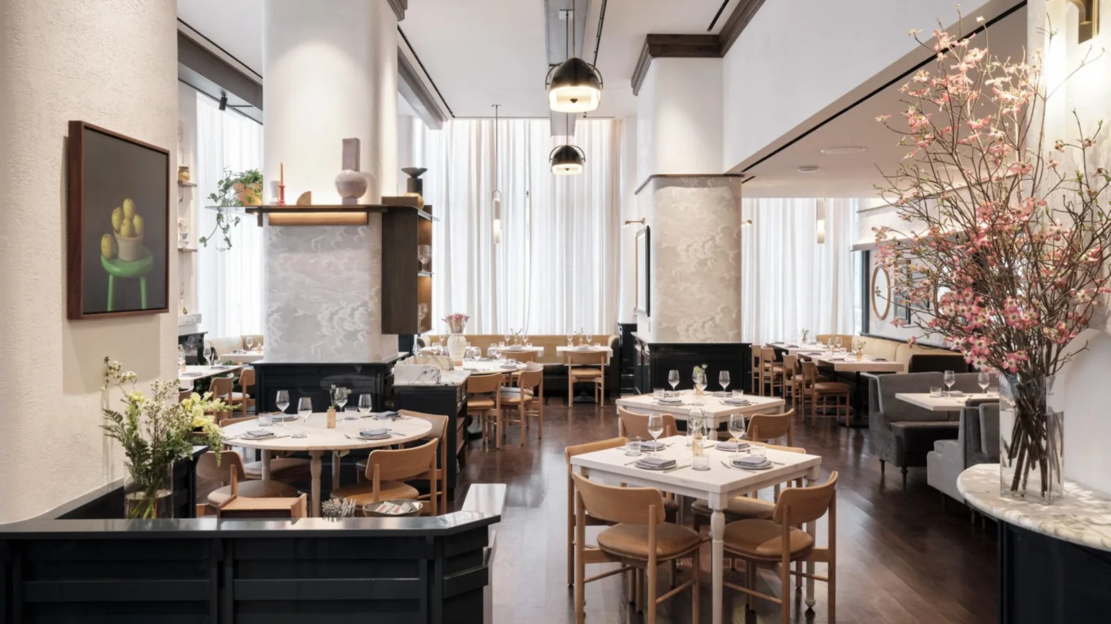 Rendering of the Greywind dining room at Hudson Yards with marble tables and cherry blossom branches