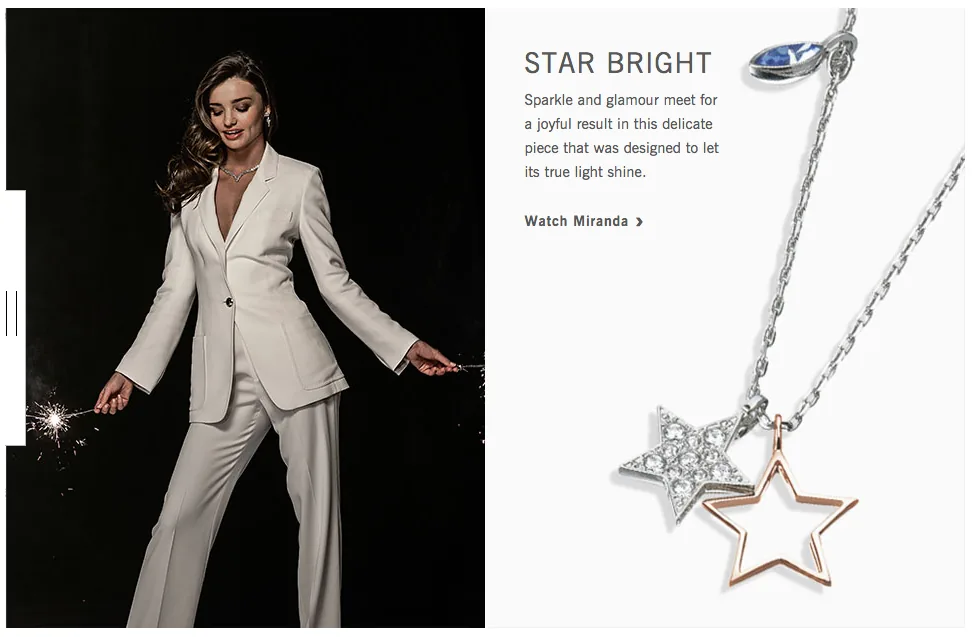 Swarovski web page Star Bright: Miranda Kerr in a white suit holding a sparkler beside a star pendant