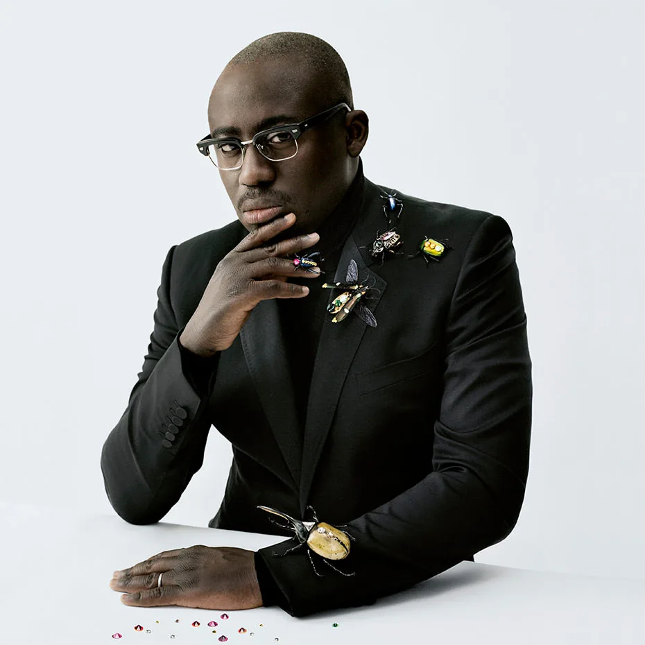 Edward Enninful in a black suit with crystal insect brooches, Swarovski Brilliant Inspiration portrait