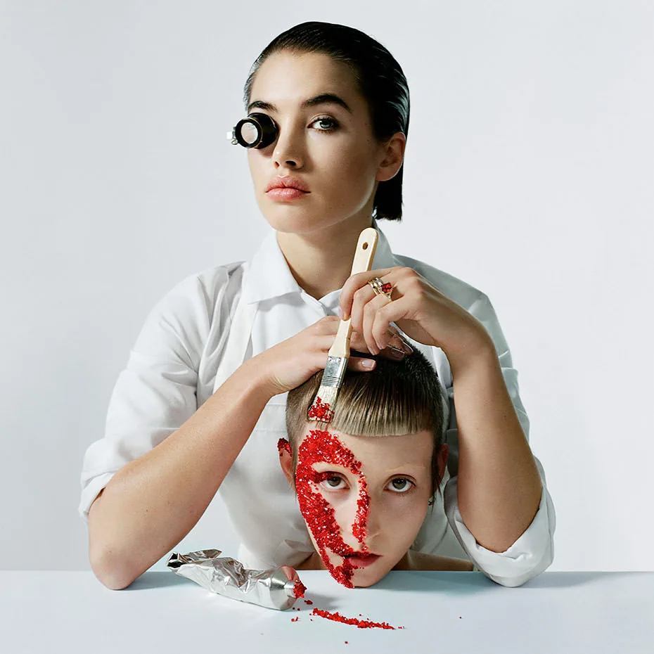 Isamaya Ffrench with a paintbrush and scarlet crystals across a model's face, Swarovski portrait