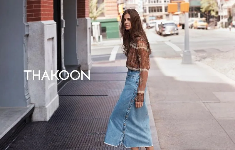 Thakoon Fall 16 campaign still: model in a denim midi skirt and knit on a Soho sidewalk