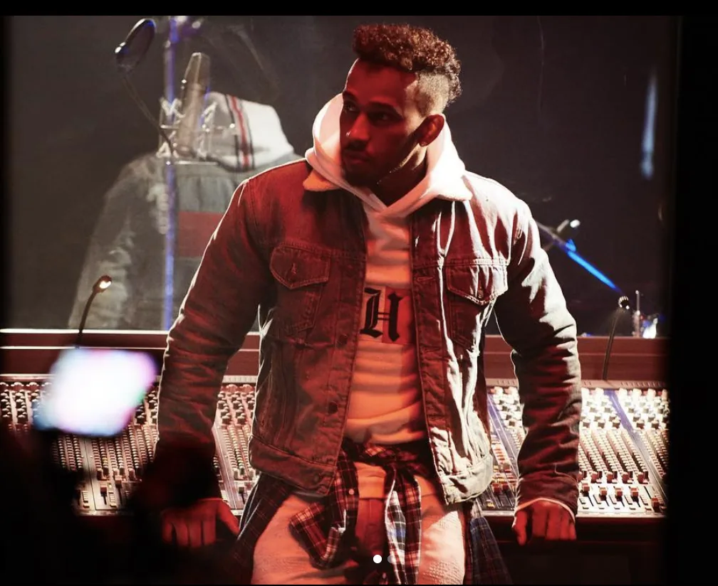 Tommy Icons behind the scenes: Lewis Hamilton in a denim jacket and hoodie at a mixing desk
